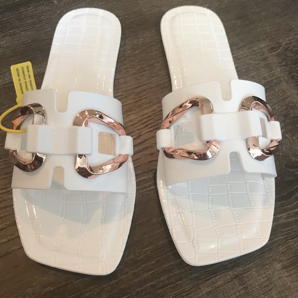 White sandals with gold detail